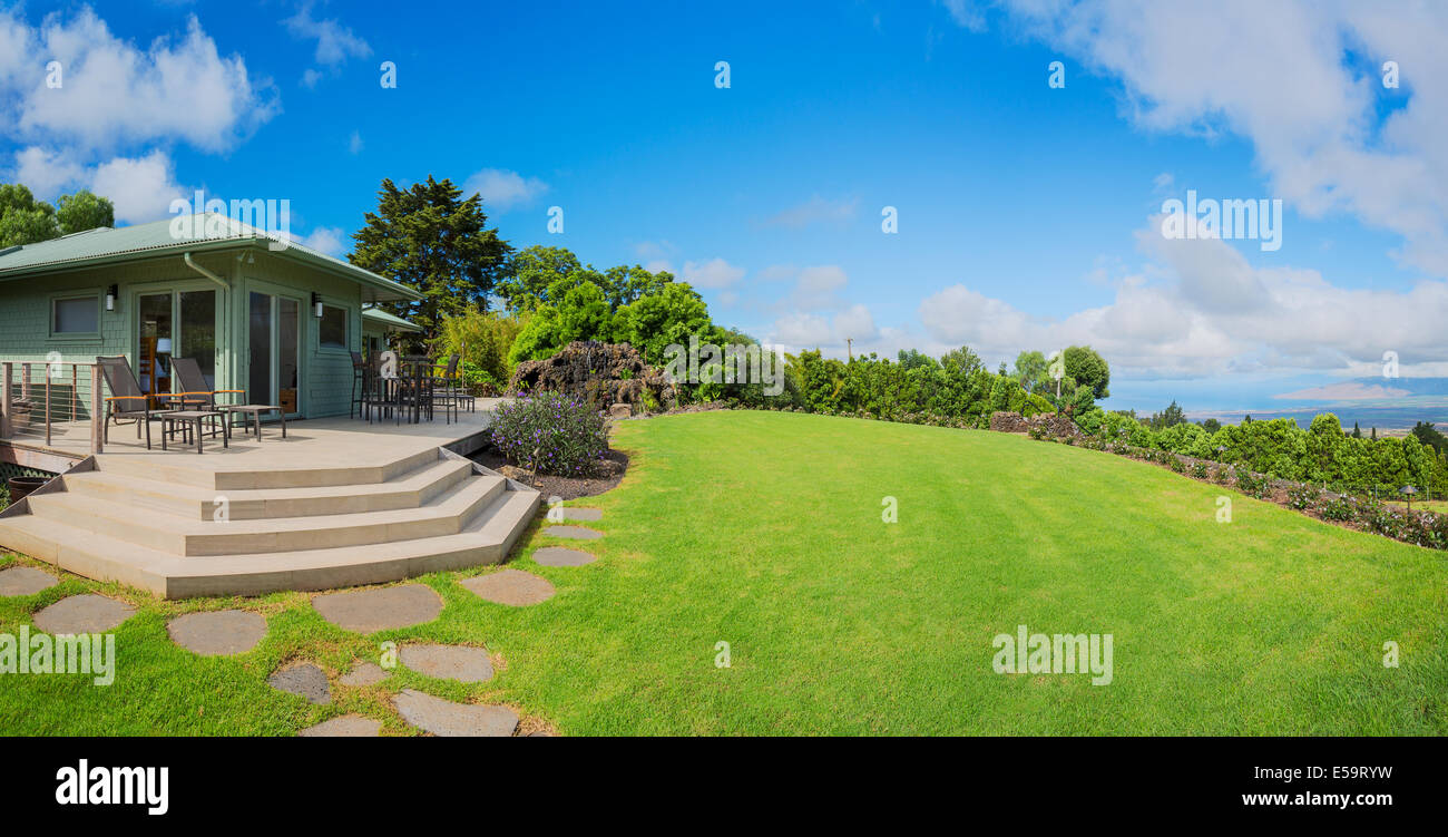 Suburban home with garden and green grassy lawn Stock Photo