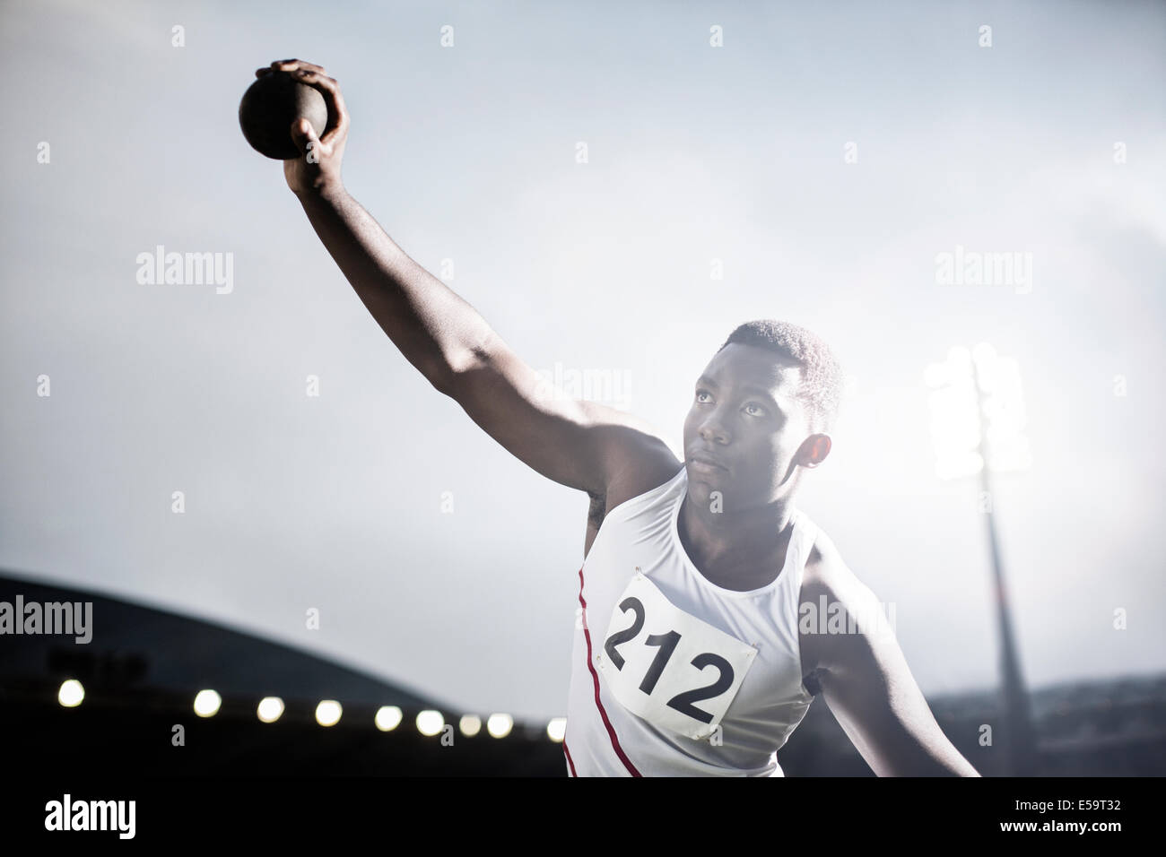 Track and field athlete throwing shot put Stock Photo Alamy