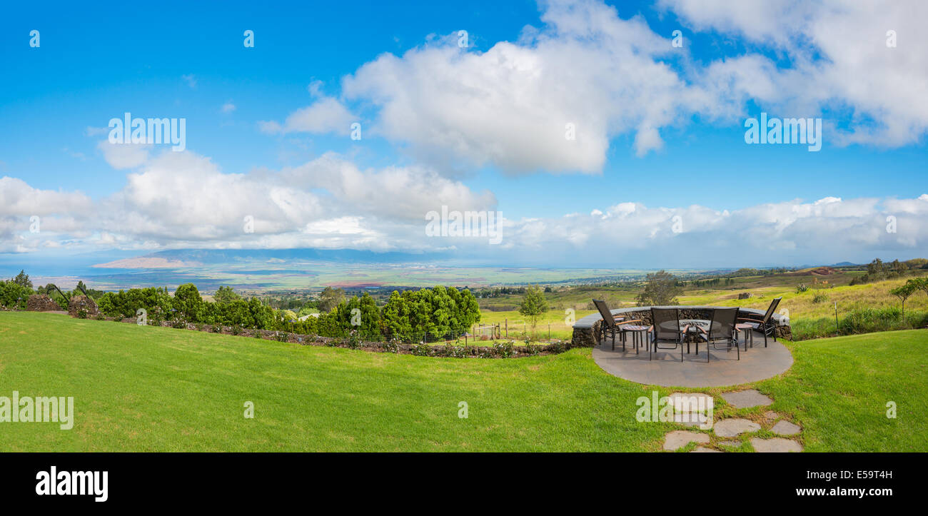 Backyard lawn with deck and incredible view Stock Photo