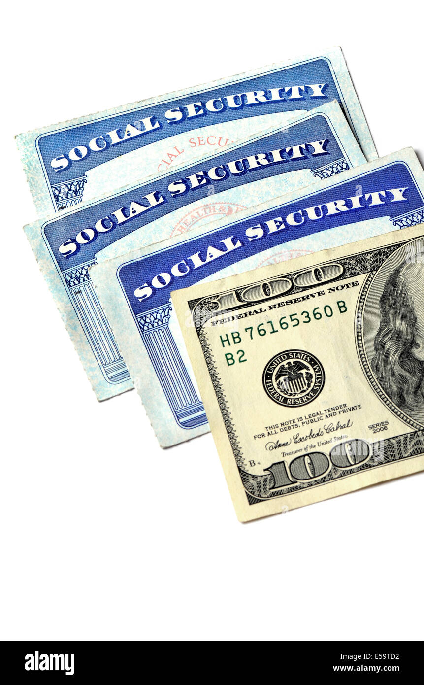 Detail of several Social Security Cards and cash money symbolizing retirement pensions financial safety Stock Photo