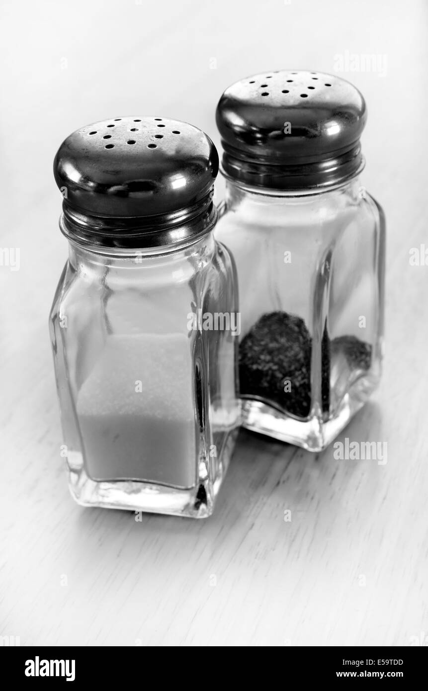 Detail of salt and pepper shakers on table top Stock Photo