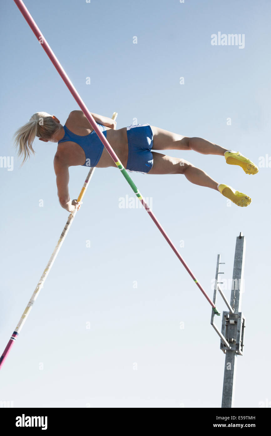 Pole vaulter clearing bar Stock Photo Alamy