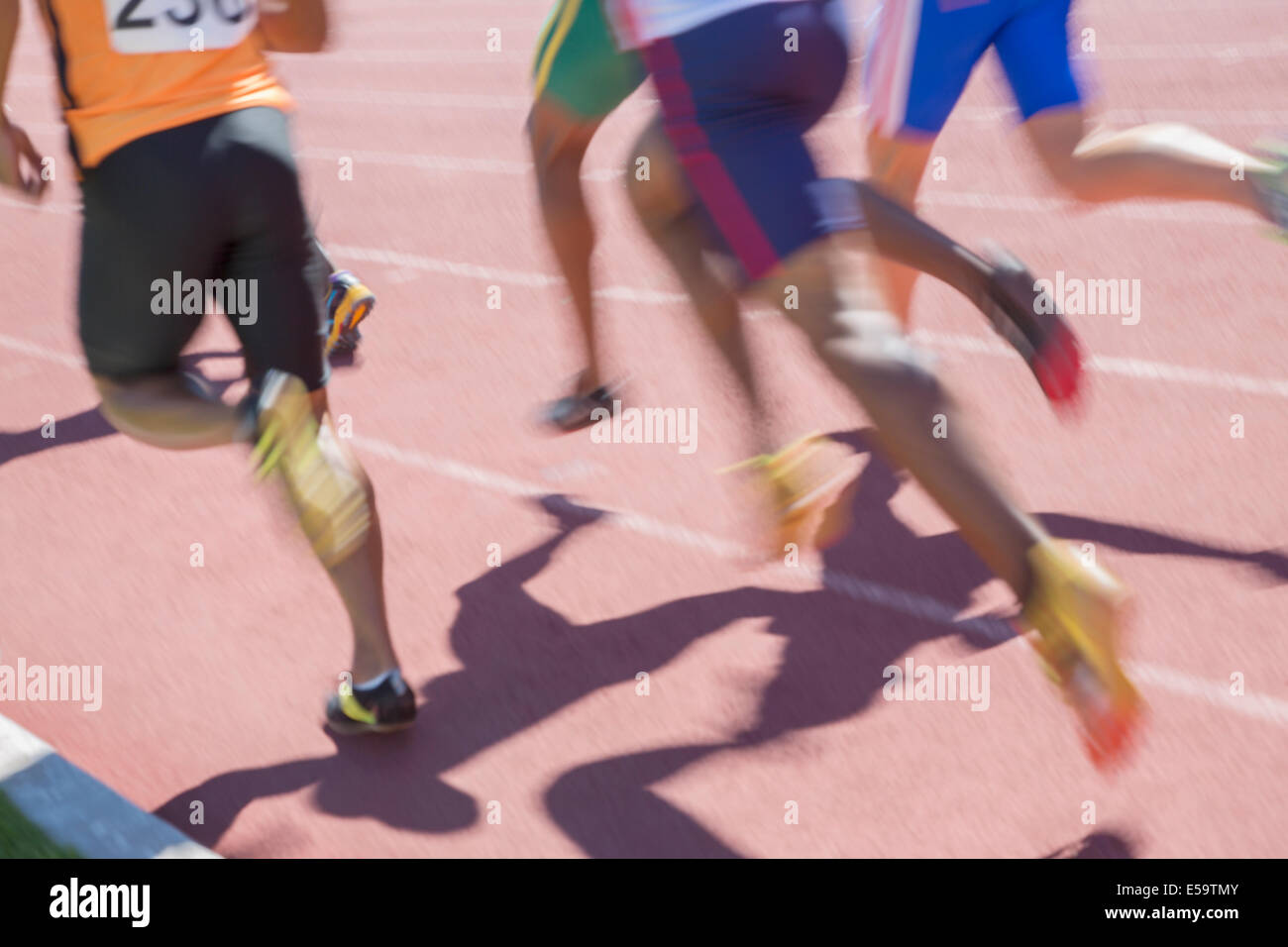 Sprinters racing on track Stock Photo Alamy