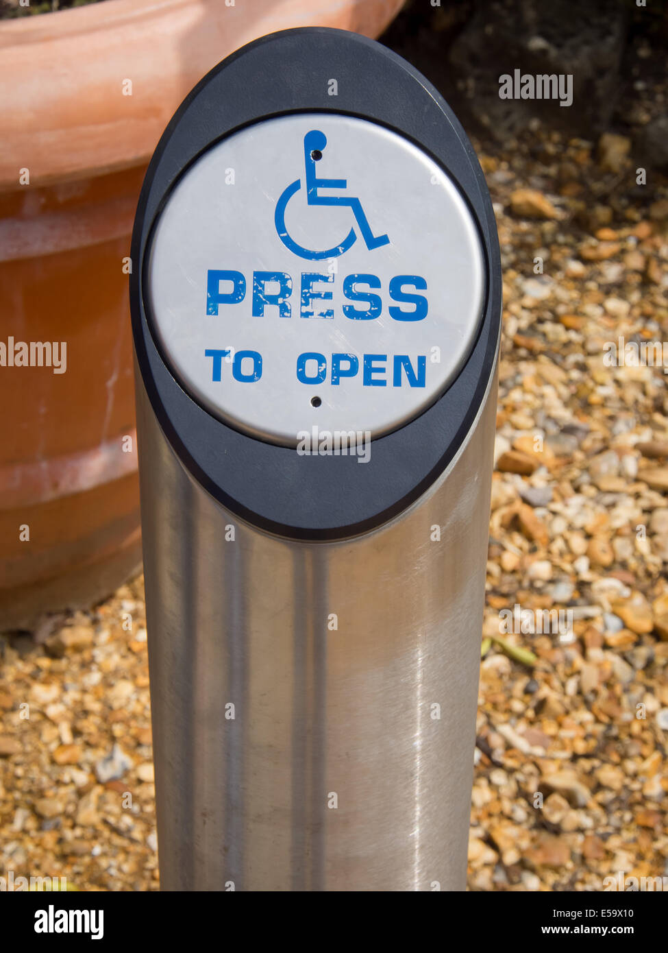 A disabled door access button on a post Stock Photo
