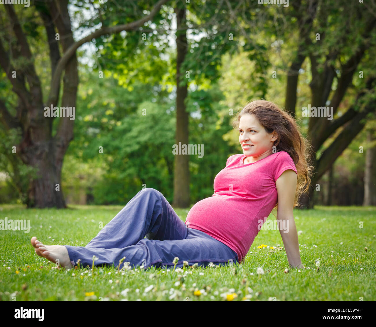 Beautiful pregnant woman in the park Stock Photo - Alamy