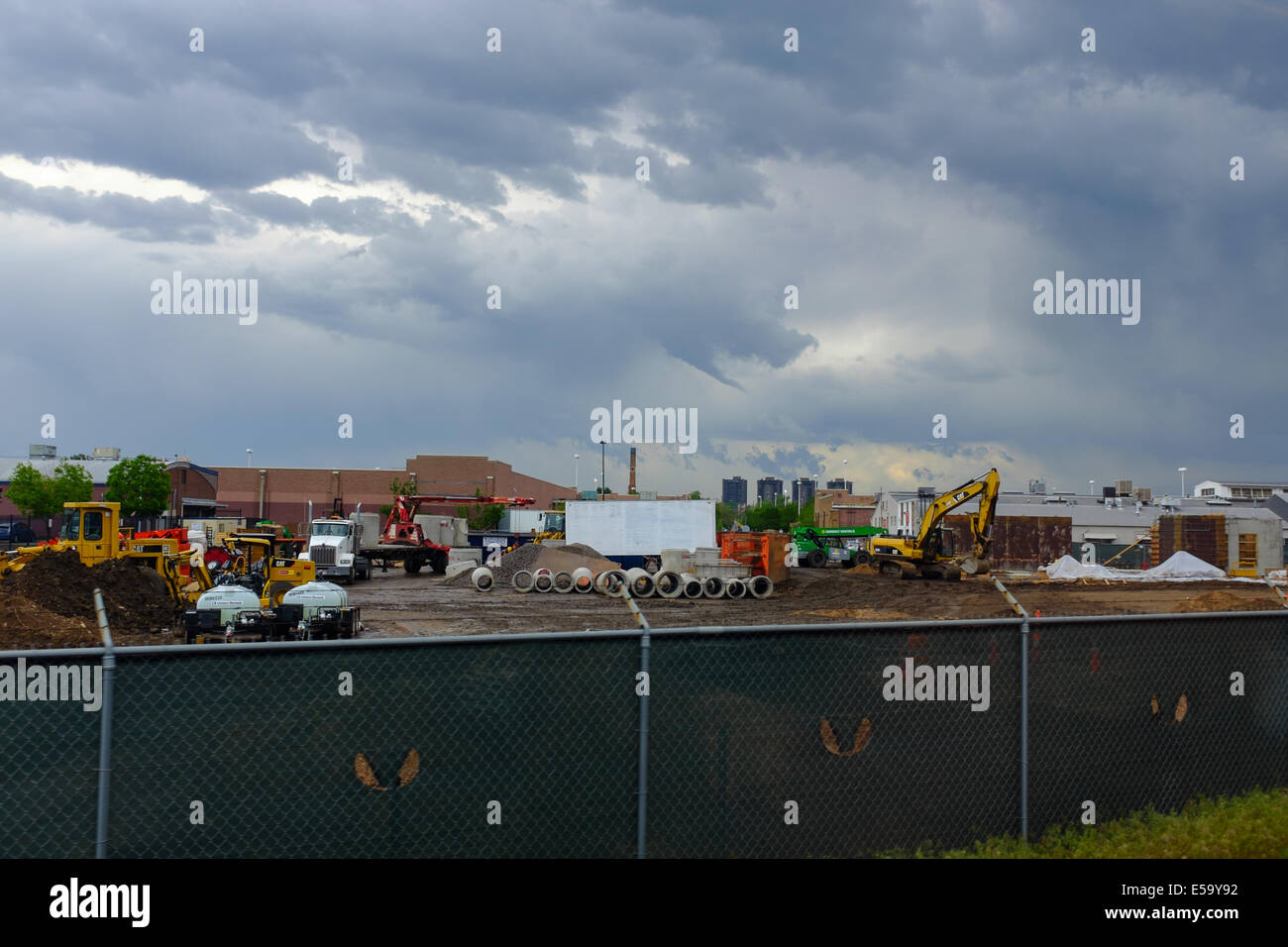 A funnel cloud lingers over a construction site in Denver, Colorado