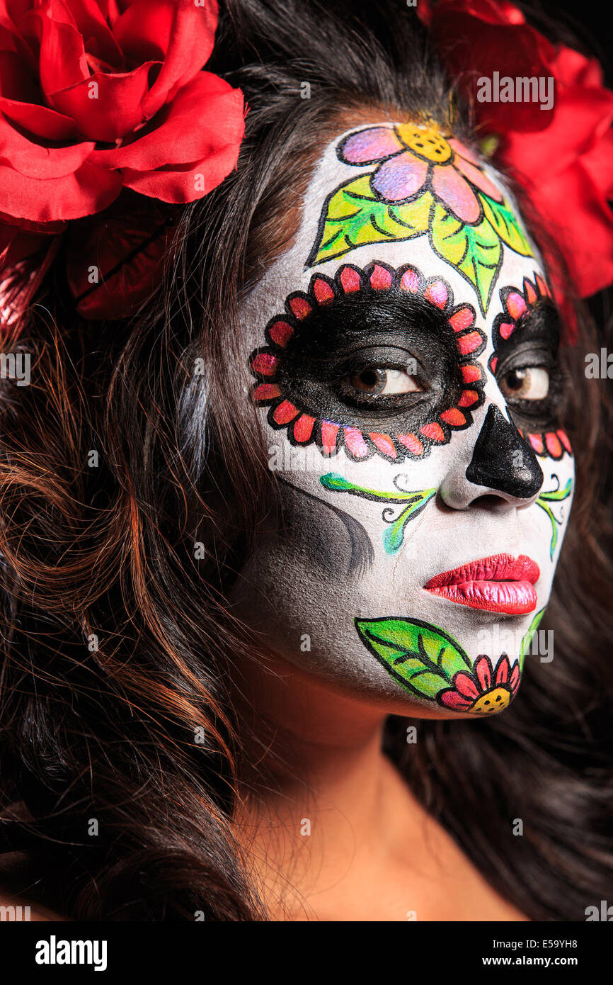 A young woman with Face Paint in the form of a sugar skull decorated for Dia  de Los Muertos Stock Photo - Alamy