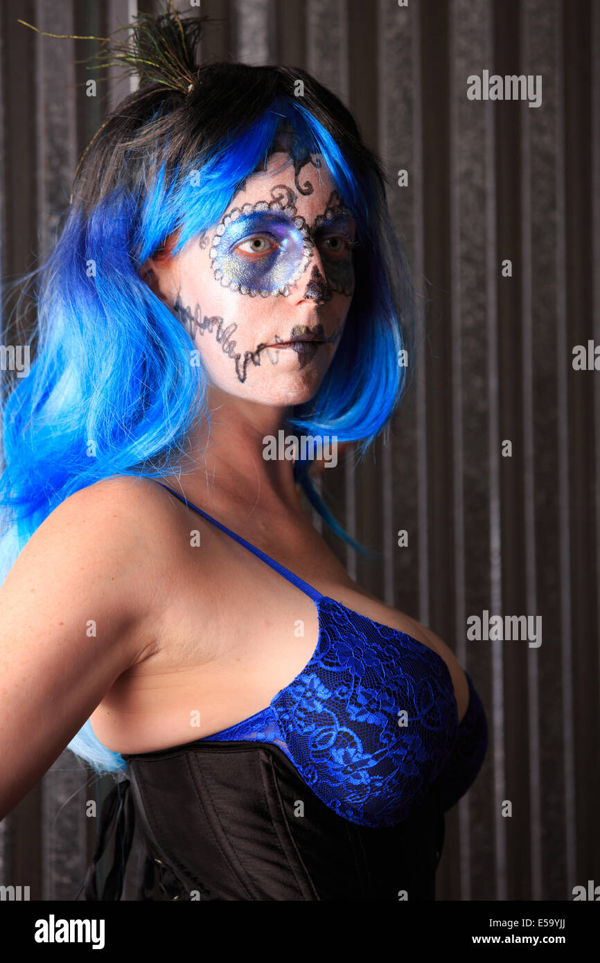 A young woman with Face Paint in the form of a sugar skull decorated for Dia de Los Muertos Stock Photo