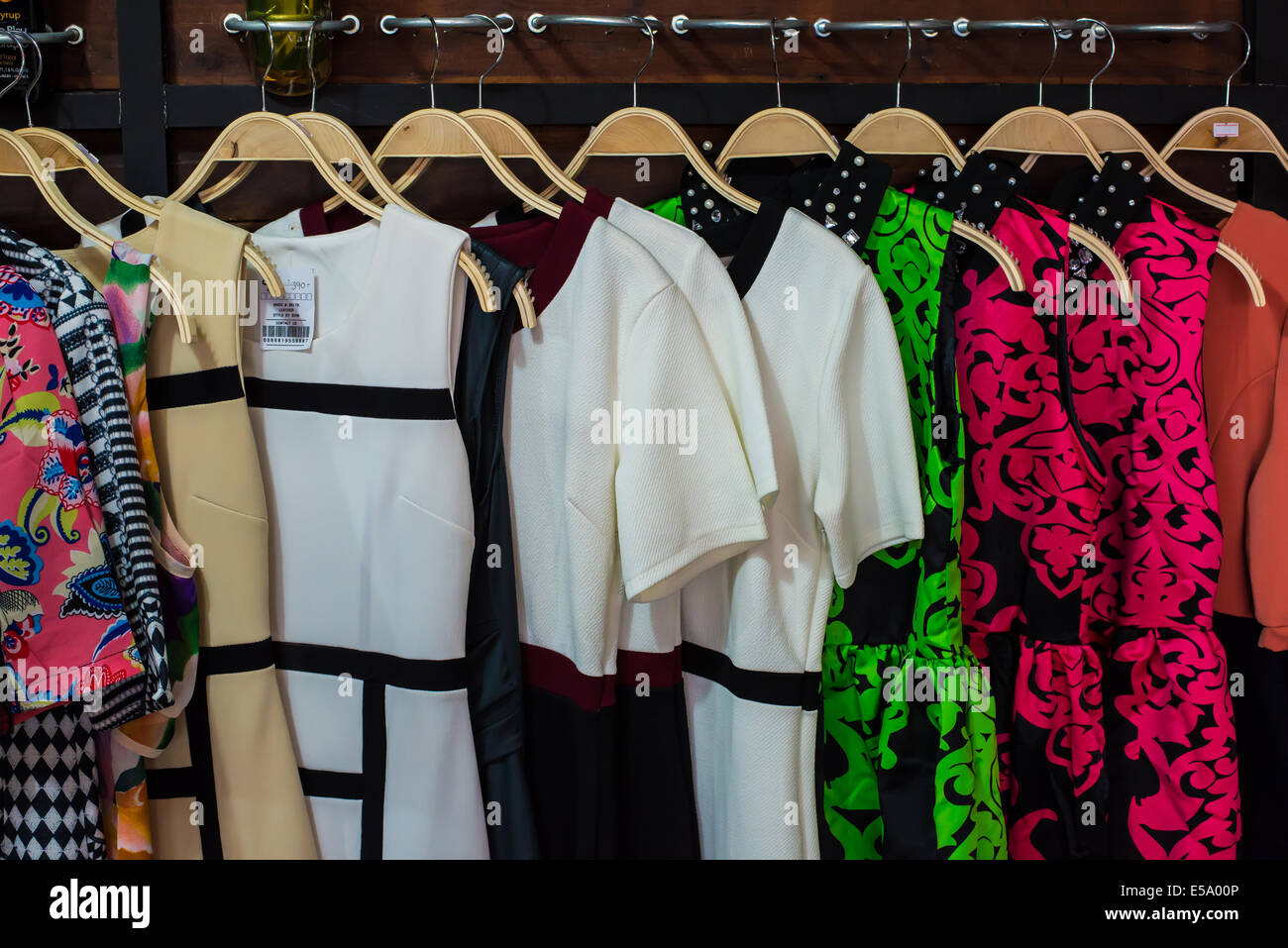 Colorful blouse hanging on clothesline in a shop Stock Photo Alamy