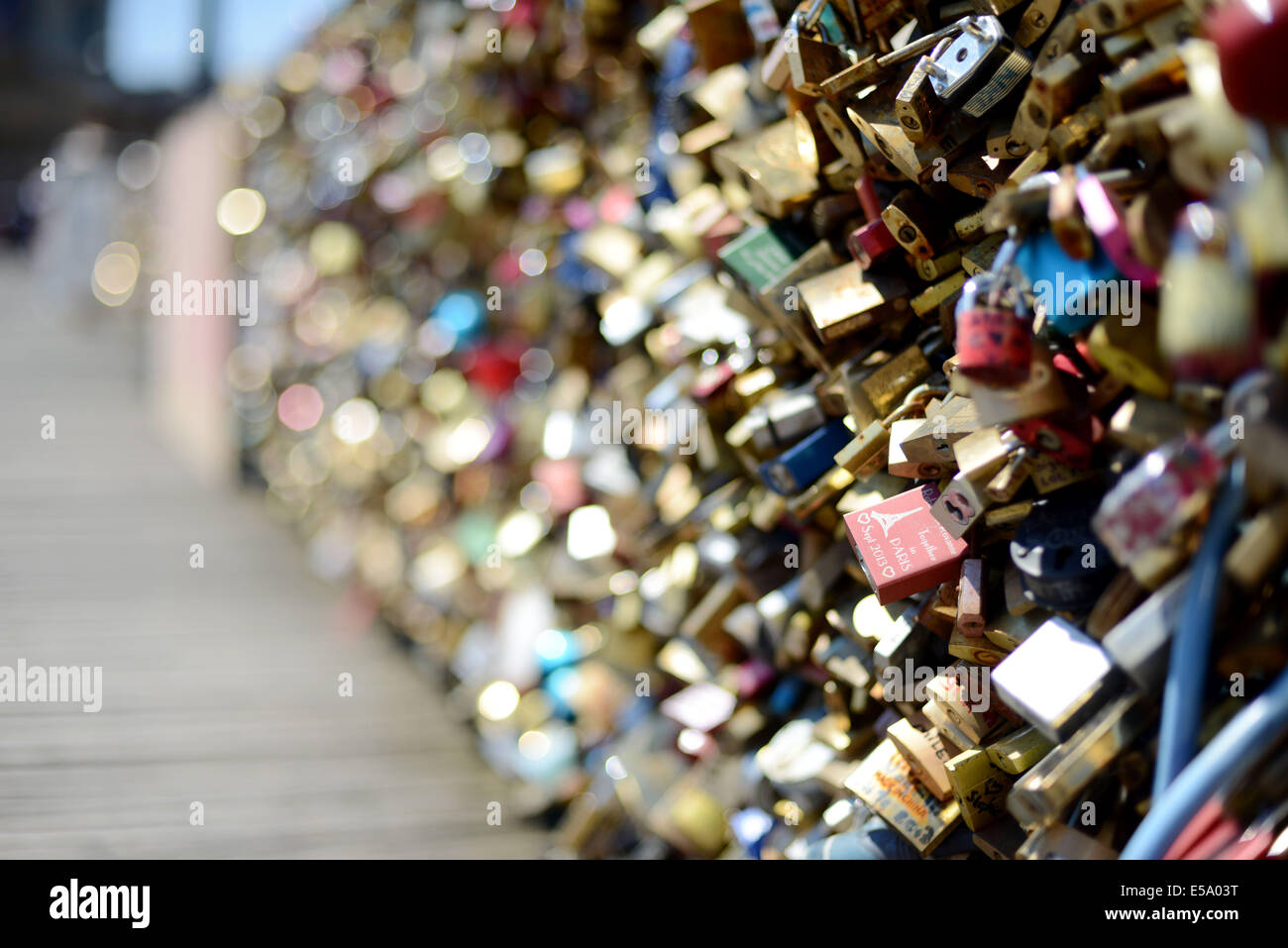 Padlocks on the fence of Paris' famous Pont des Arts in France, where romantic couples attach locks to proclaim their love. Stock Photo