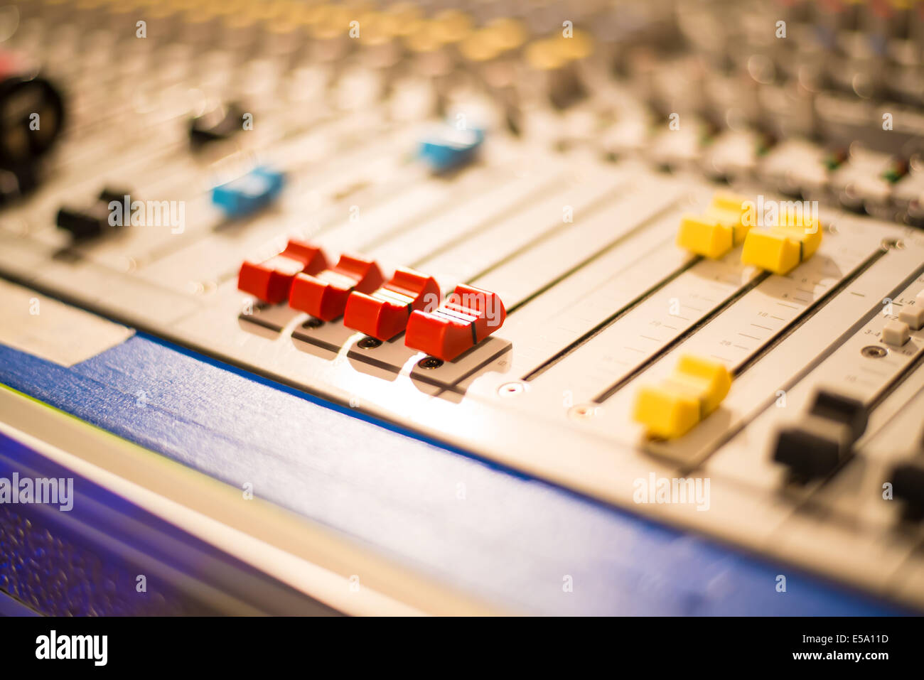 Slider on a sound mixer with blurs Stock Photo