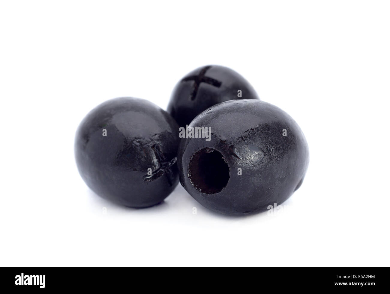 Marinated black olive closeup isolated on white background Stock Photo
