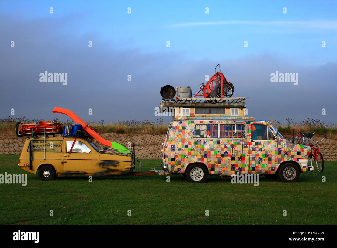 Sheerness, Isle of Sheppey, Kent, England UK, Friday 25th July 2014 Del Boy and the Trotters on Tour fast asleep this morning whilst camping at Bartons Point Coastal Park. Aahhh bless 'em. Credit:  Paul Hamilton/Alamy Live News Stock Photo