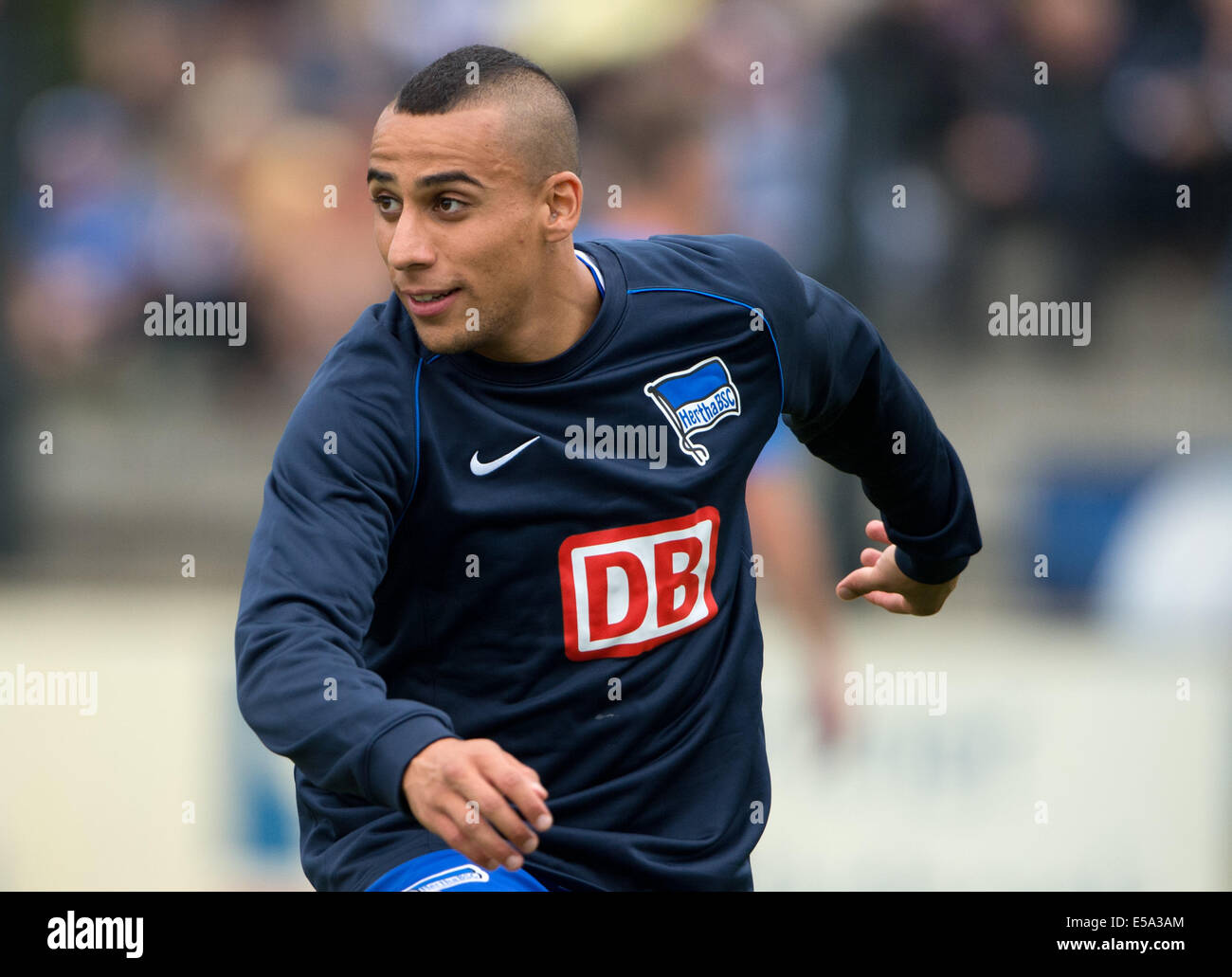 Berlin, Germany. 24th July, 2014. Hertha's Anis Ben-Hatira warms up during the friendly match Hertha BSC against PSV Eindhoven at Stadion auf dem Wurfplatz in Berlin, Germany, 24 July 2014. Photo: SOEREN STACHE/dpa/Alamy Live News Stock Photo