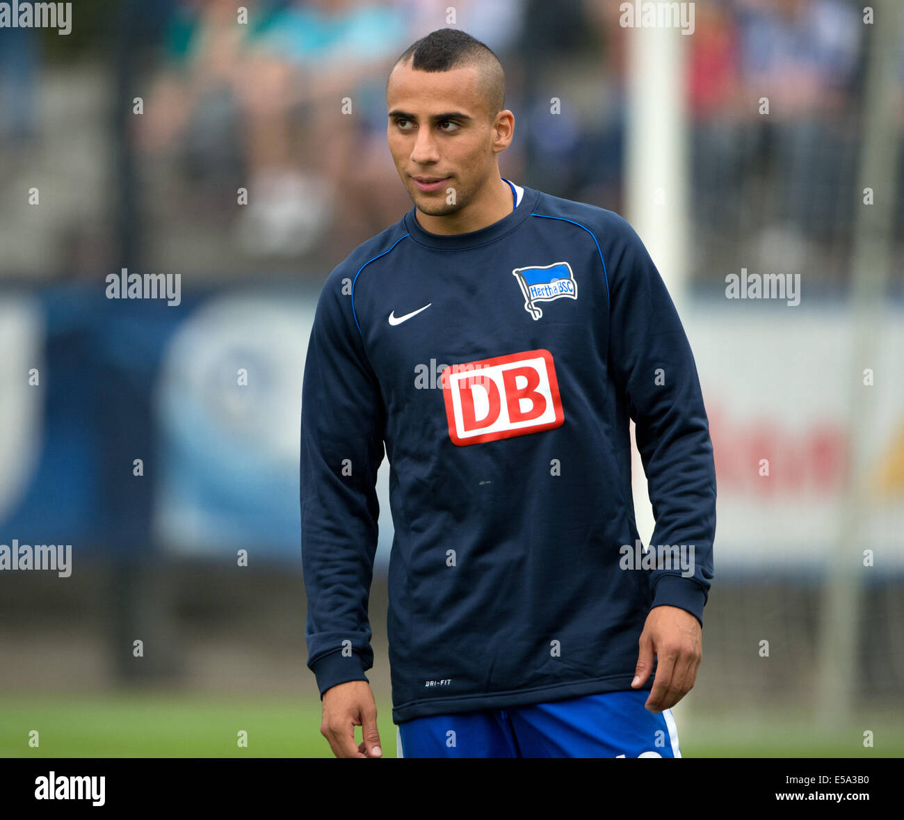 Berlin, Germany. 24th July, 2014. Hertha's Anis Ben-Hatira warms up during the friendly match Hertha BSC against PSV Eindhoven at Stadion auf dem Wurfplatz in Berlin, Germany, 24 July 2014. Photo: SOEREN STACHE/dpa/Alamy Live News Stock Photo