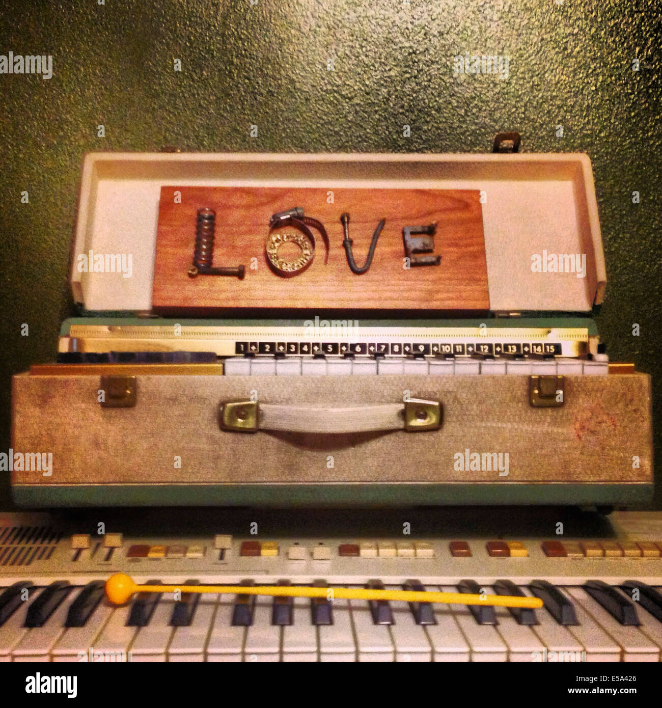 Letters spelling 'love' on harmonium - Smartphone Captured Stock Image