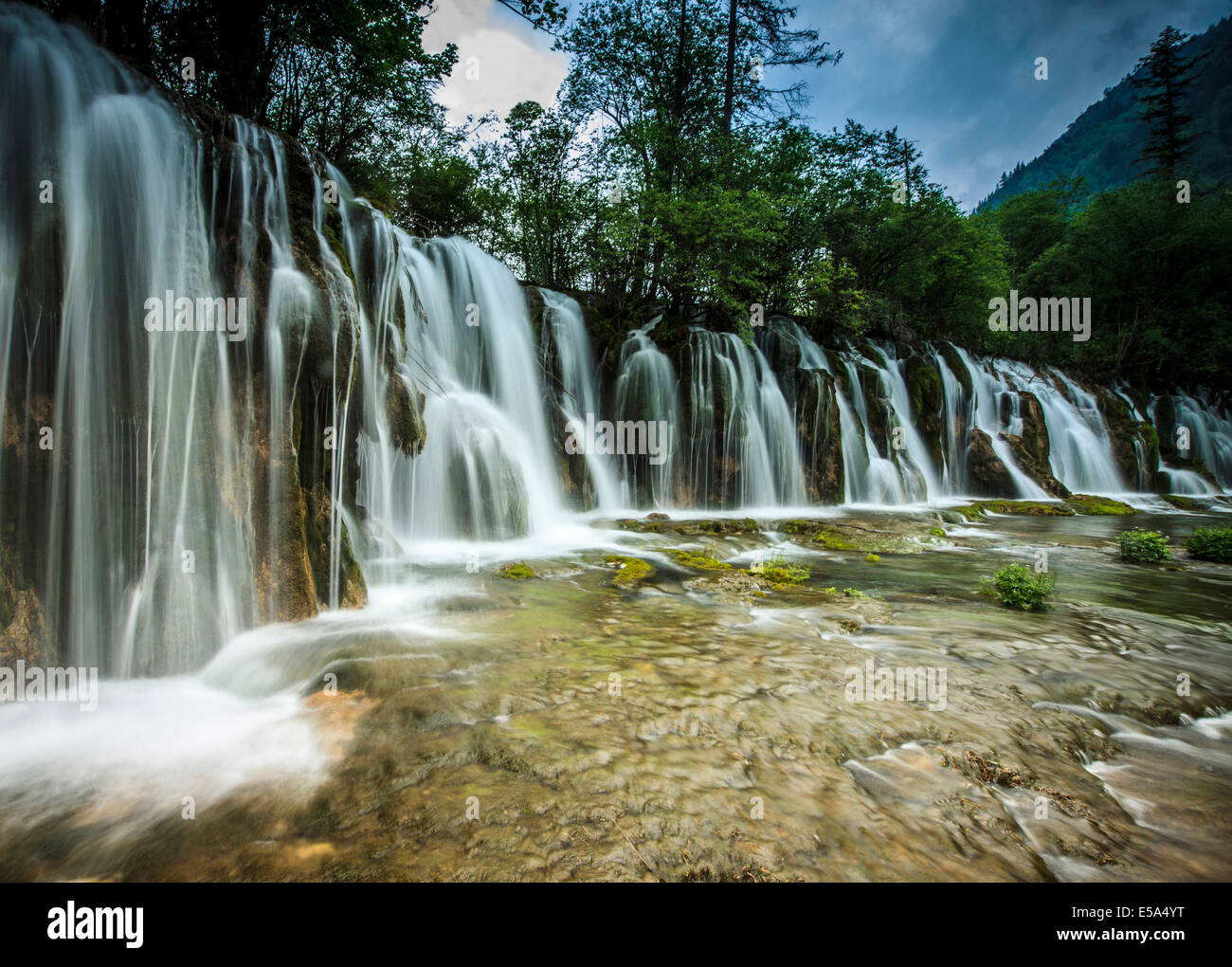 Waterfall in rural landscape Stock Photo - Alamy