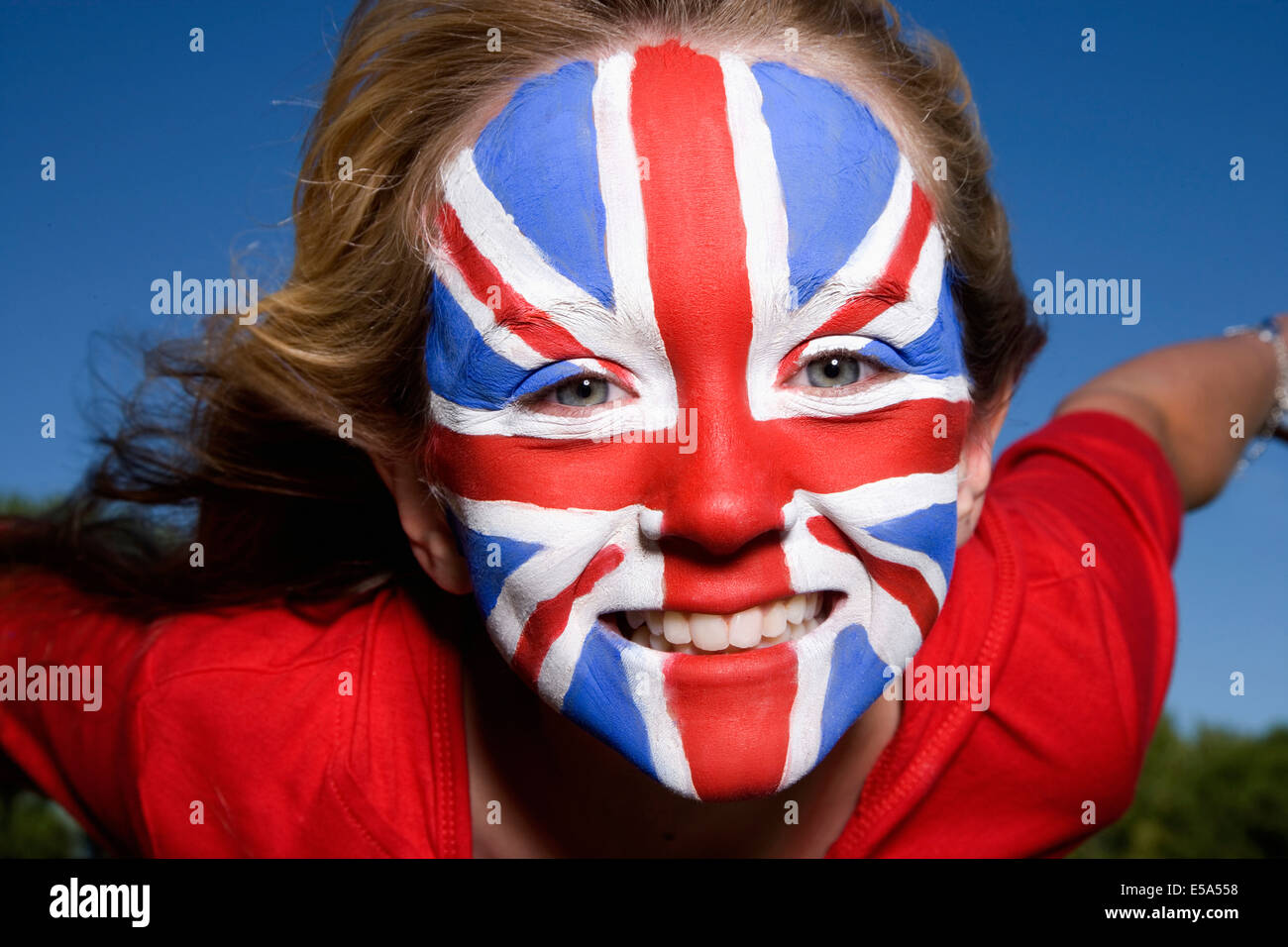 Caucasian girl with United Kingdom flag painted on face Stock Photo