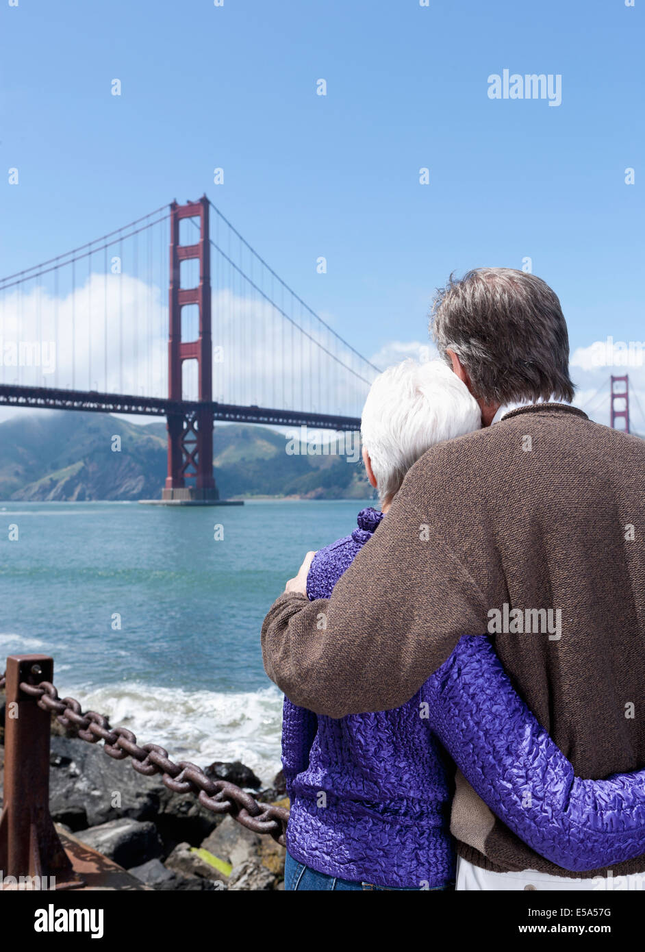 Senior Caucasian couple admiring Golden Gate Bridge, San Francisco, California, United States Stock Photo