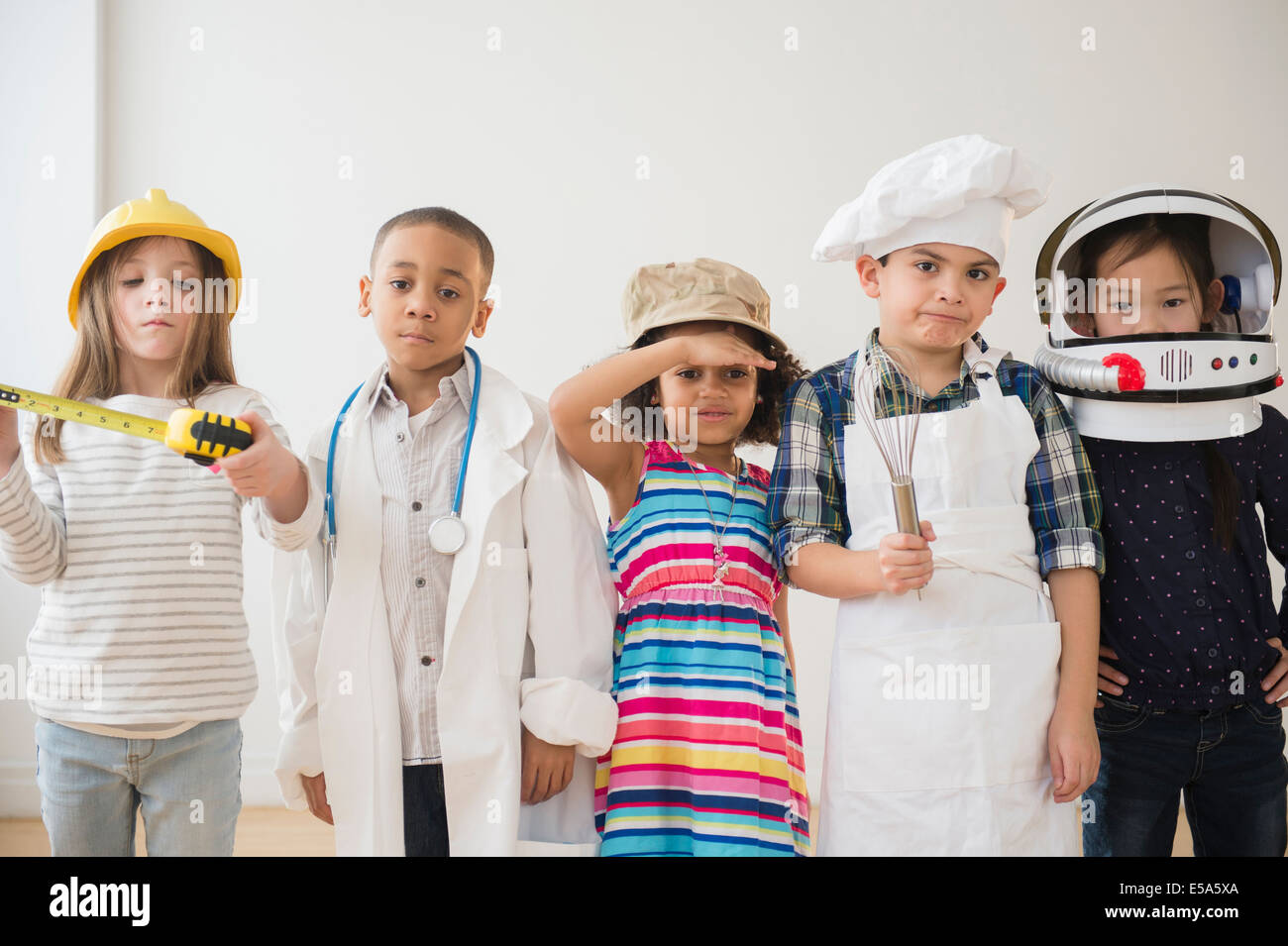 Children playing dress up together Stock Photo