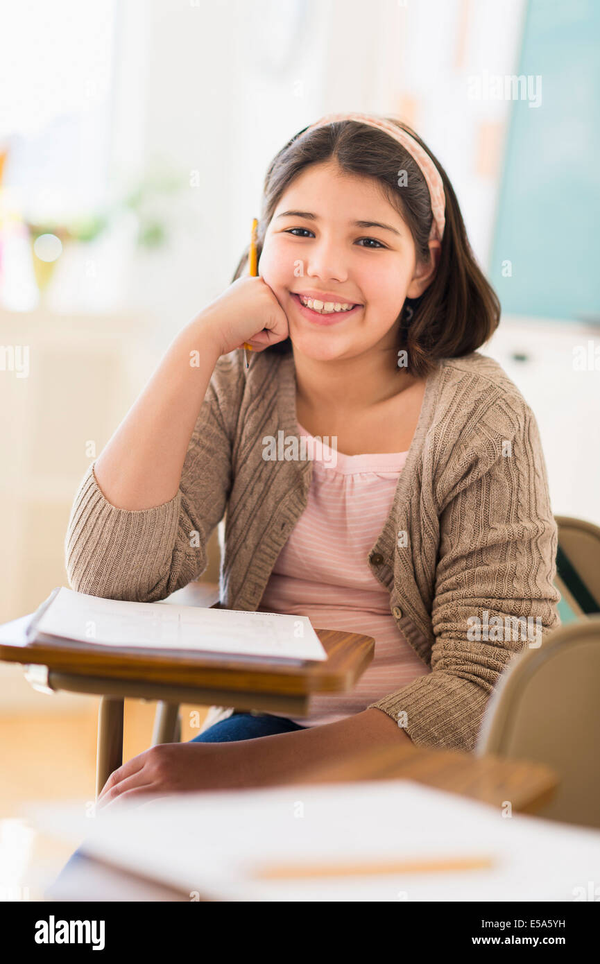 Hispanic girl smiling in classroom Stock Photo - Alamy