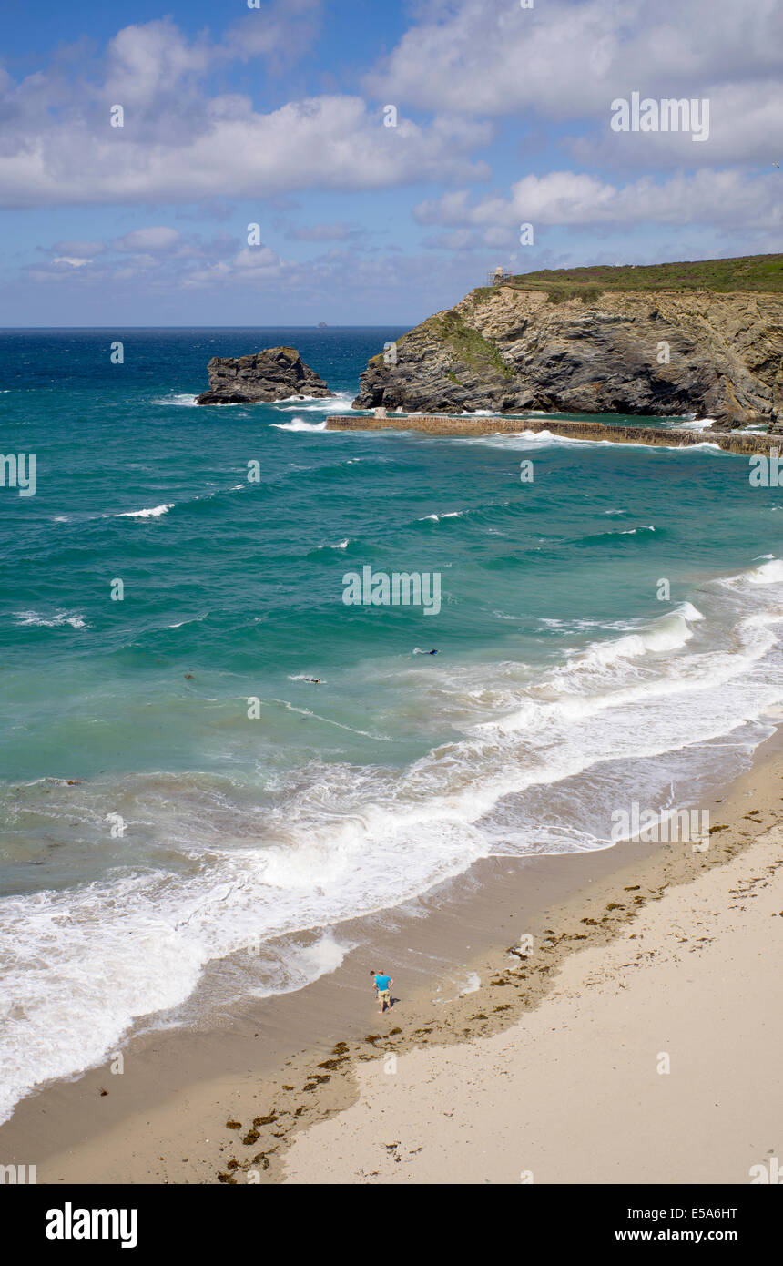 Portreath beach shore in Cornwall UK. Looking down from a cliff top on a sunny day. Stock Photo
