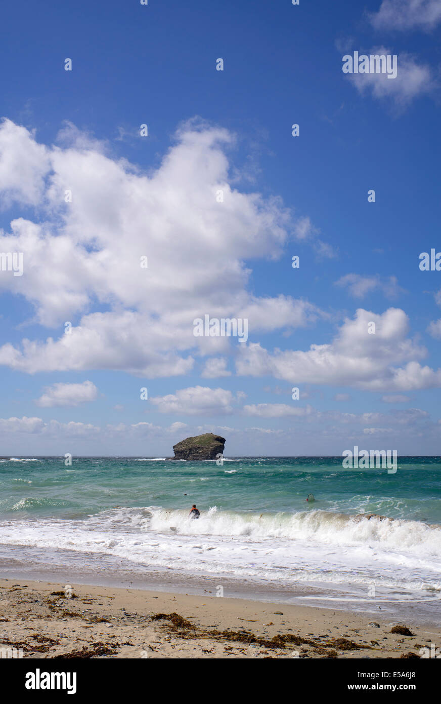 Portreath beach shore surf waves white clouds and big blue sky, Cornwall England. Stock Photo