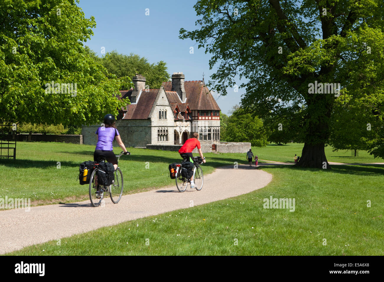 Cyclists and walkers enjoy the grounds of Studley Royal Park in North Yorkshire Stock Photo