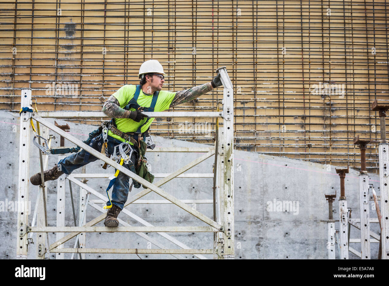 Caucasian worker on scaffolding Stock Photo