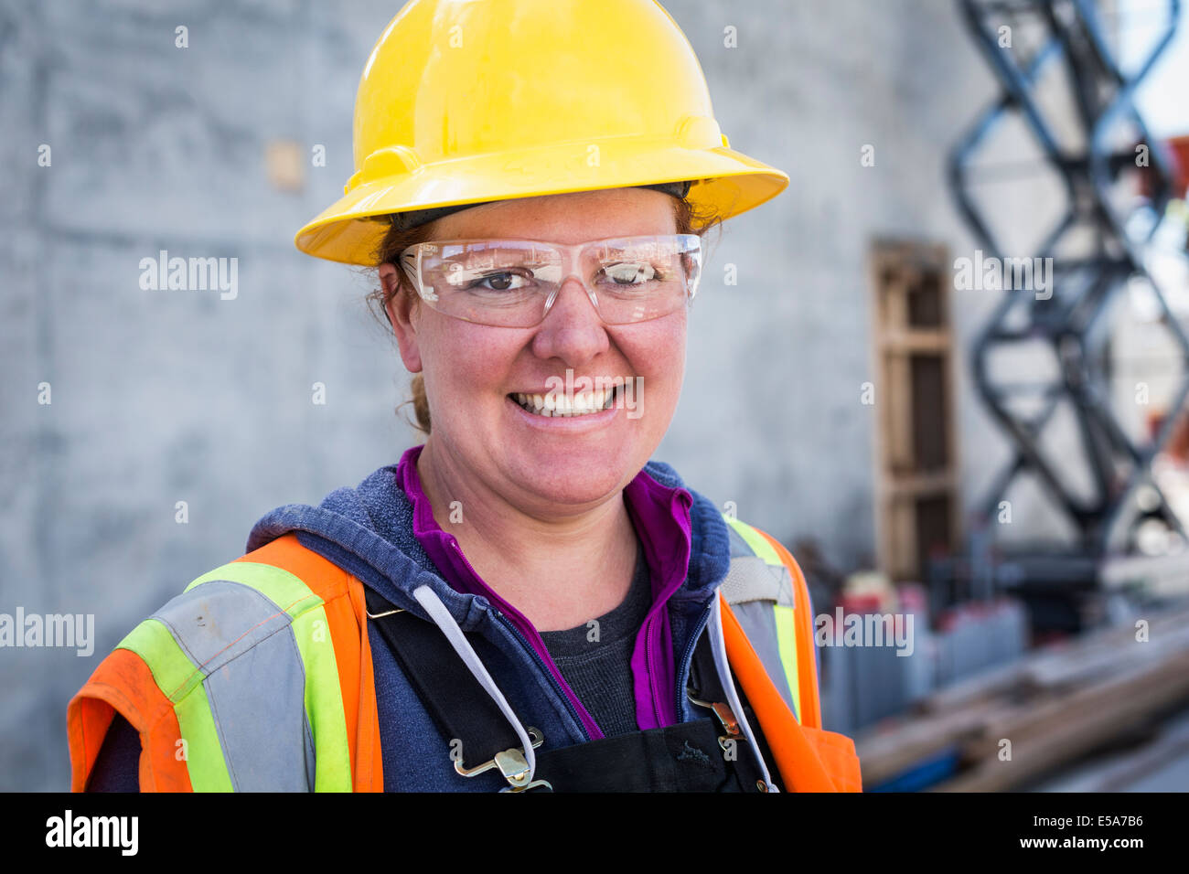 Caucasian worker wearing safety goggles on site Stock Photo