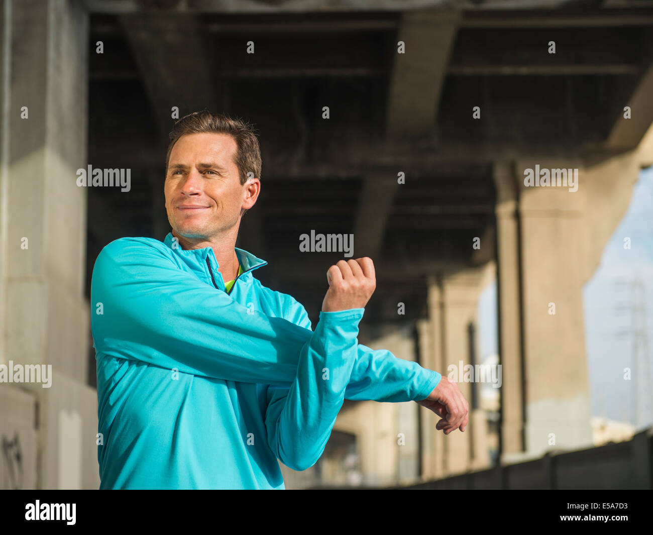 Man stretching on bridge hi-res stock photography and images - Alamy