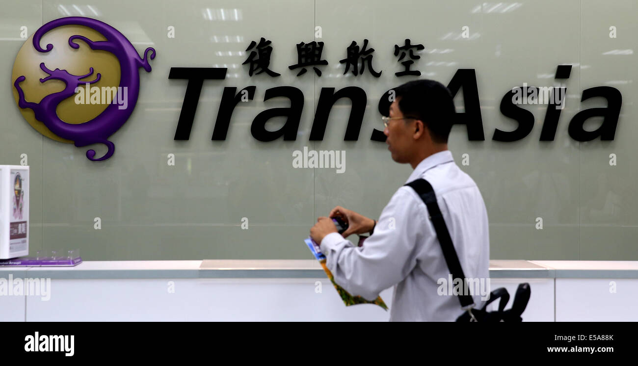 TransAsia Airways holds press conference after plane crashed in Taipei.A TransAsia Airways turboprop ATR-72 plane crashed on its second attempt at landing during a thunderstorm in Penghu county, southern Taiwan on Wednesday, July 23, 2014, killing 48 people and setting buildings on fire, officials said. Stock Photo