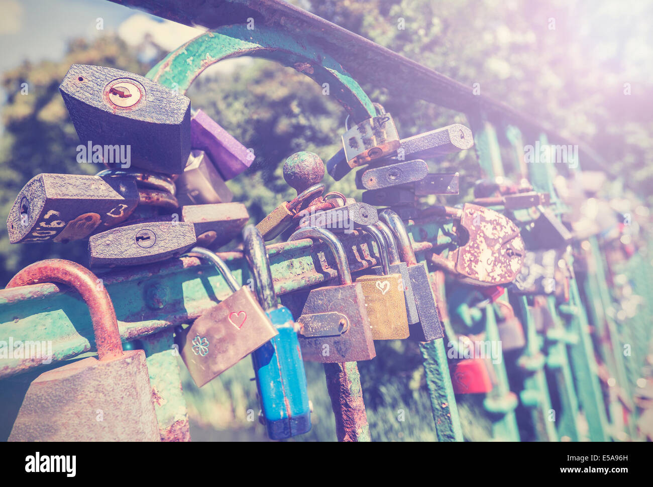 Padlocks on a Bridge, vintage style photo. Stock Photo