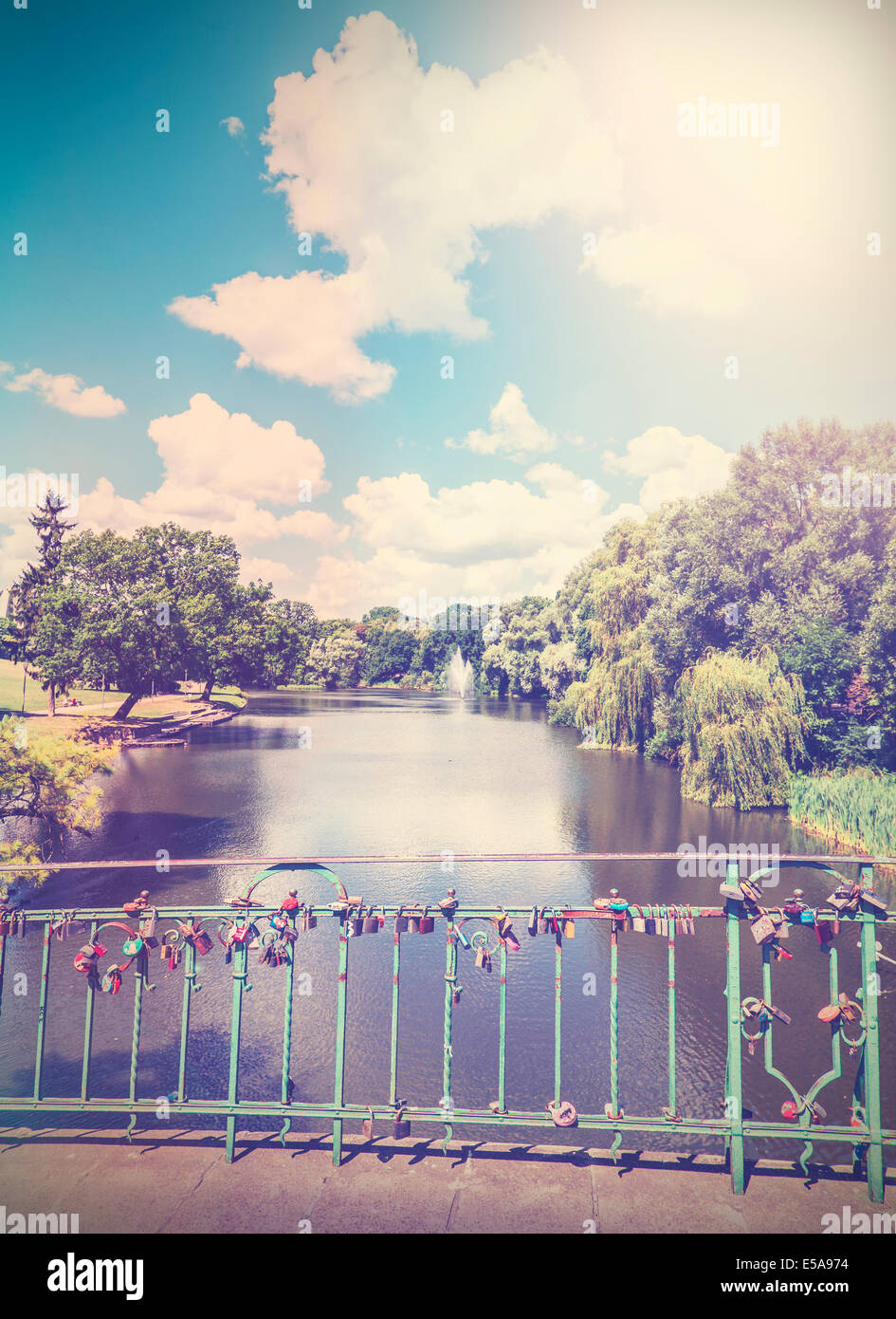 Vintage nature background with padlocks on bridge. Stock Photo