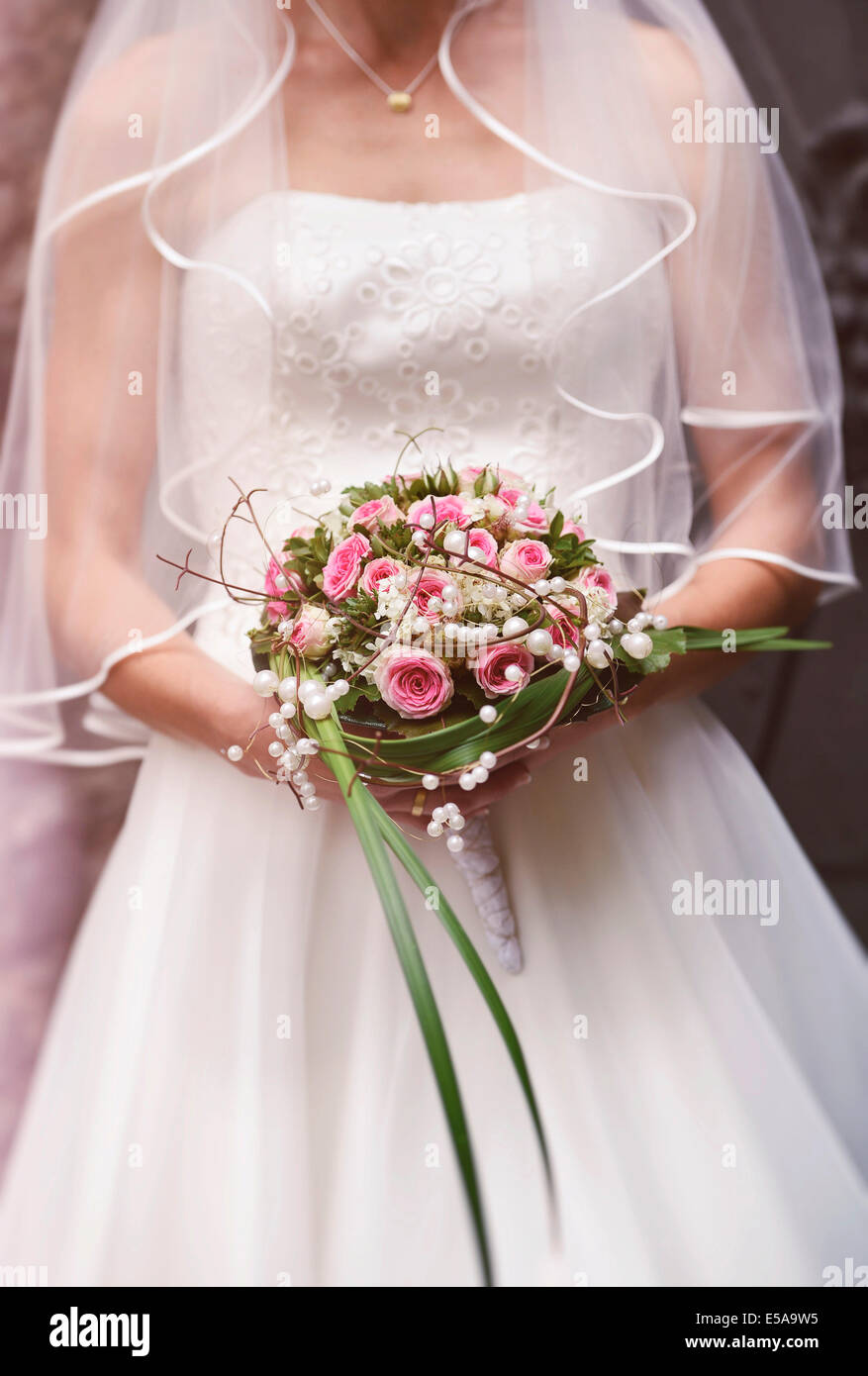 Bride, bridal bouquet, wedding dress, veil Stock Photo