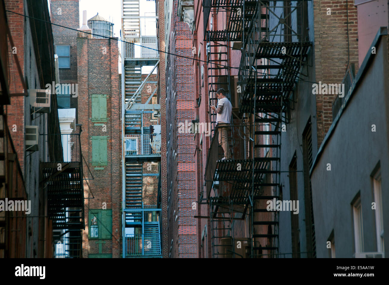 Narrow alleyway with fire escapes in Soho lower East side Manhattan New York City Stock Photo