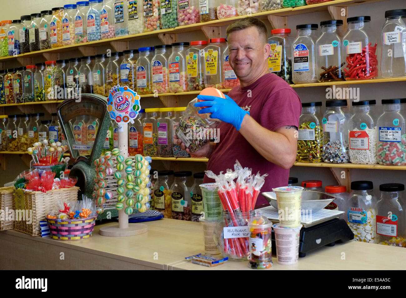 Shopkeeper Serving Sweets At A Traditional English Sweet Shop Stock Photo Alamy Shopkeeper Serving Sweets At A Traditional English Sweet Shop Stock Photo Alamy