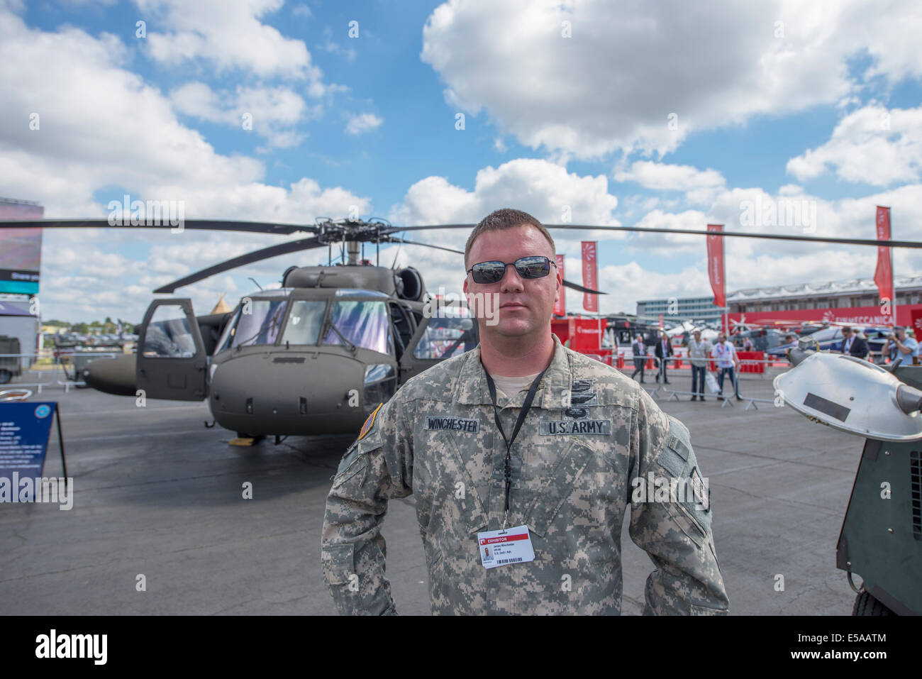 US Army pilot in front of Black Hawk helicopter at The Farnborough ...