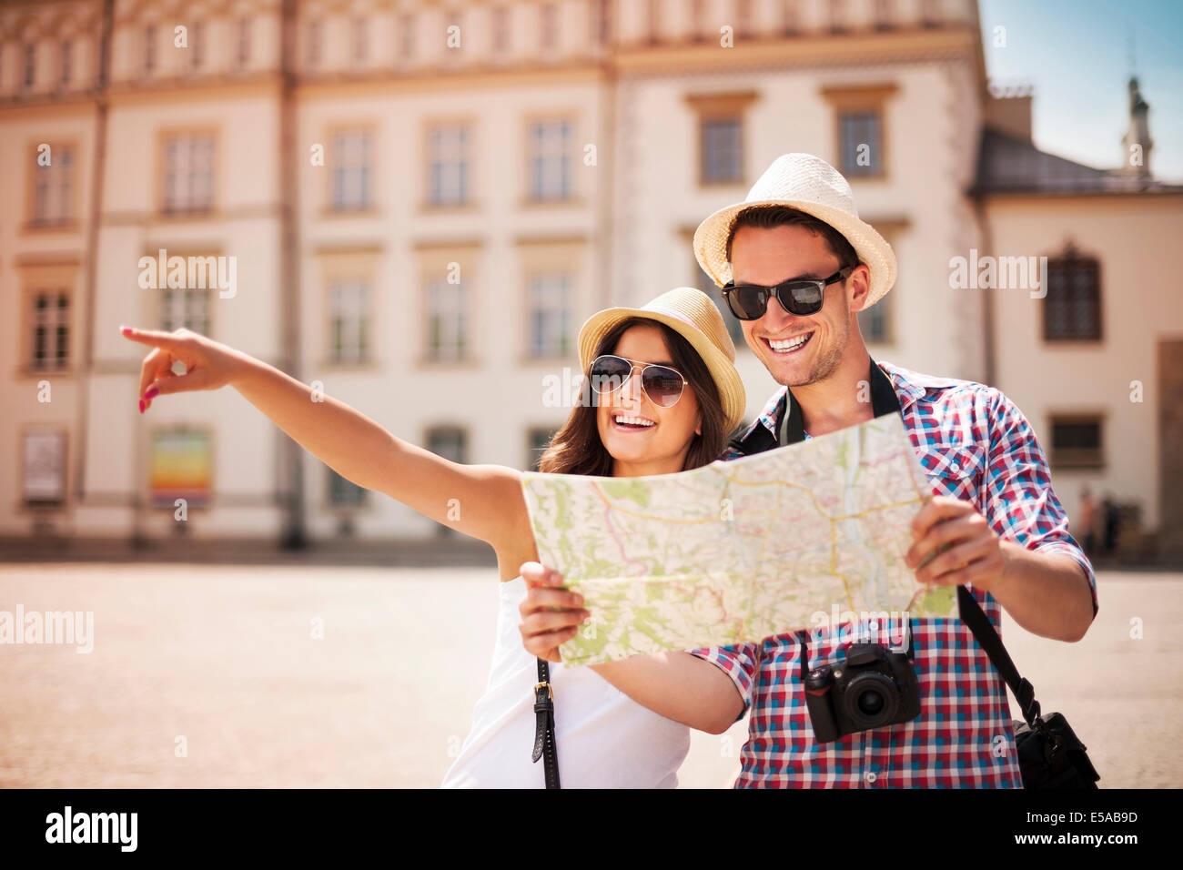 Happy tourist sightseeing city with map, Debica, Poland Stock Photo