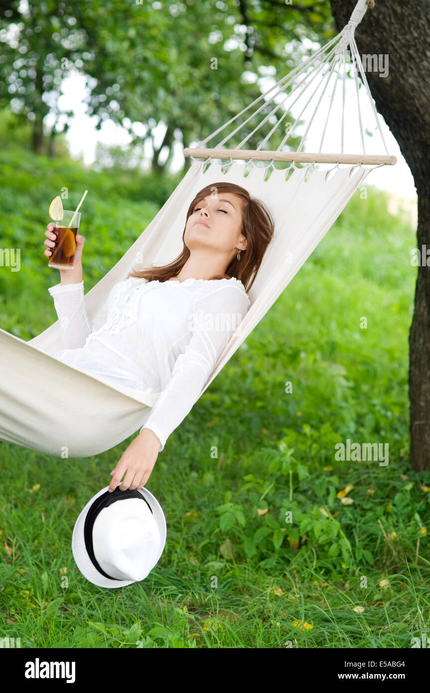 Young woman sleeping on hammock, Debica, Poland. Stock Photo