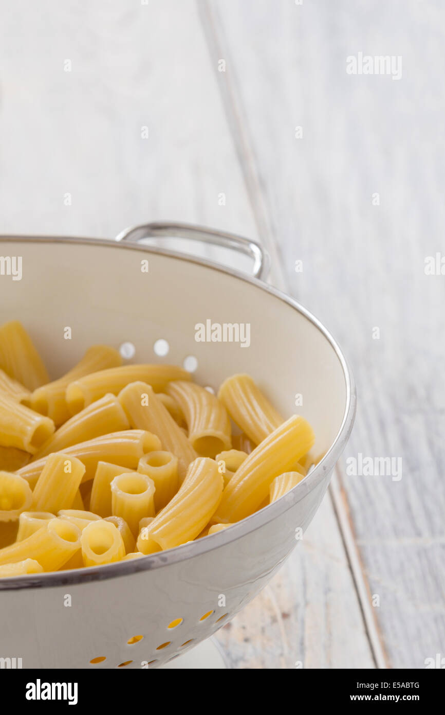 Frehs cooked Tortiglioni Pasta in a sieve on a table Stock Photo Alamy