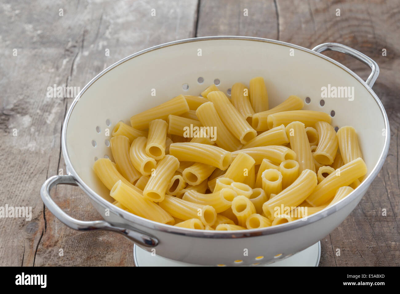 Frehs cooked Tortiglioni Pasta in a sieve on a table Stock Photo Alamy