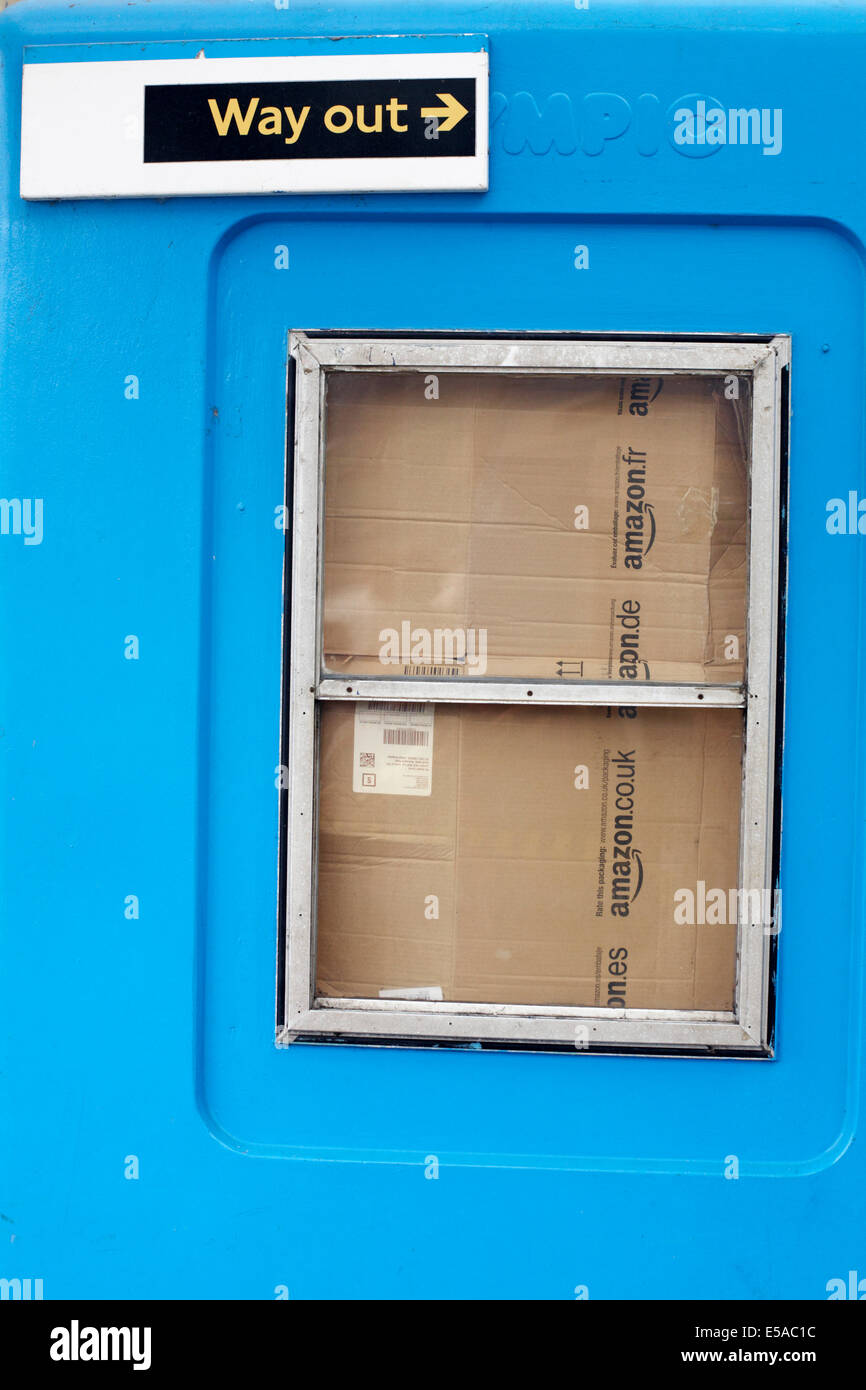 Amazon cardboard packaging blocking windows and way out sign at ferry boat terminal at London UK in July Stock Photo