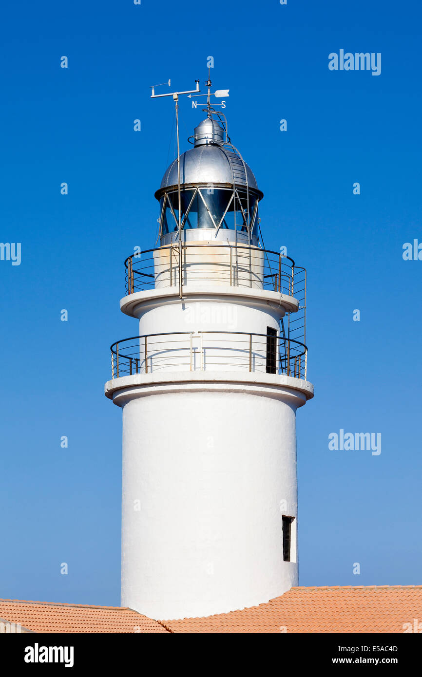 White lighthouse against a blue sky Stock Photo