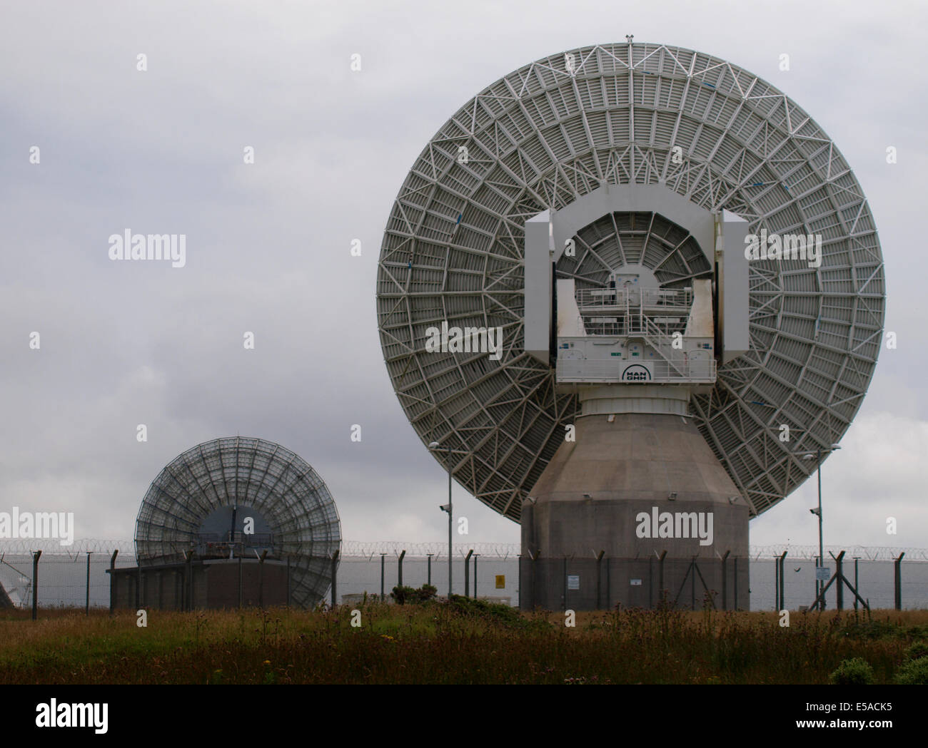 The back of two satellite antenna at GCHQ Bude, Cornwall, UK Stock