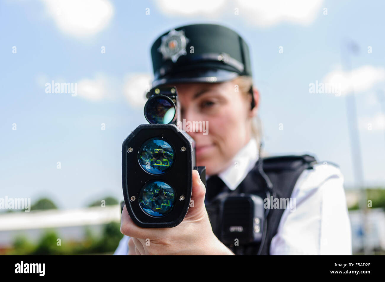 Lisburn, Northern Ireland. 25th July, 2014. - PSNI Inspector Rosie Leech from the Road Policing branch uses a laser speed detection gun. Credit:  Stephen Barnes/Alamy Live News Stock Photo