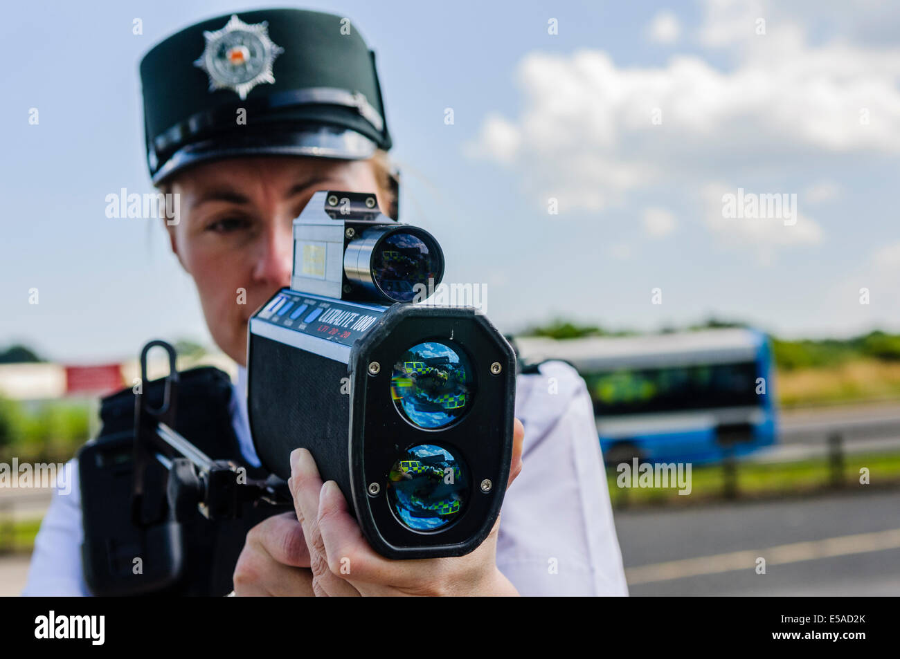 Lisburn, Northern Ireland. 25th July, 2014. - PSNI Inspector Rosie Leech from the Road Policing branch uses a laser speed detection gun. Credit:  Stephen Barnes/Alamy Live News Stock Photo