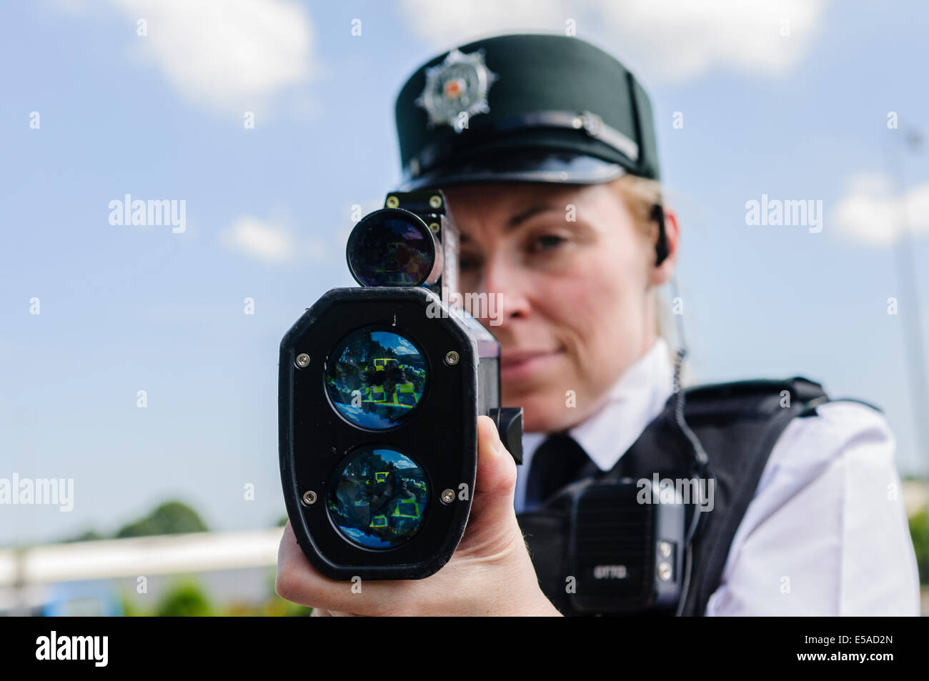 Lisburn, Northern Ireland. 25th July, 2014. - PSNI Inspector Rosie Leech from the Road Policing branch uses a laser speed detection gun. Credit:  Stephen Barnes/Alamy Live News Stock Photo