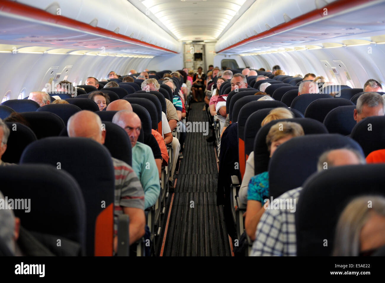 Passengers Inside Cabin Of Easyjet Airbus A319 Stock Photo