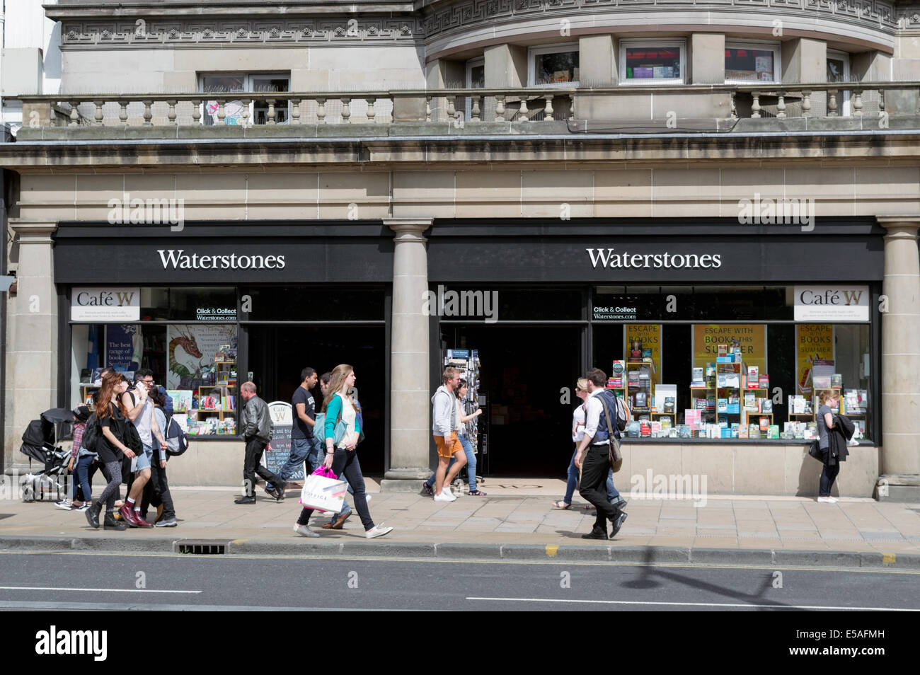 Shoppers walking past Waterstones on Princes Street Edinburgh Stock